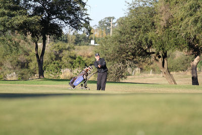 Full length of man walking on golf course