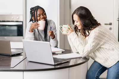 Young friends studying at home