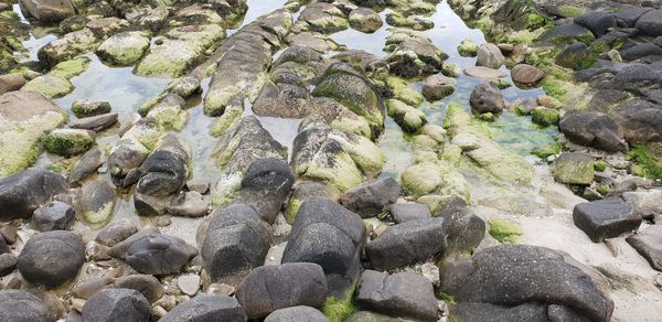 High angle view of pebbles on beach