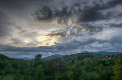 Scenic view of landscape against cloudy sky