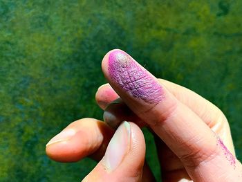 Cropped hand of person with powder paint