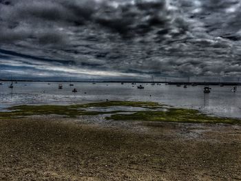 Scenic view of sea against cloudy sky
