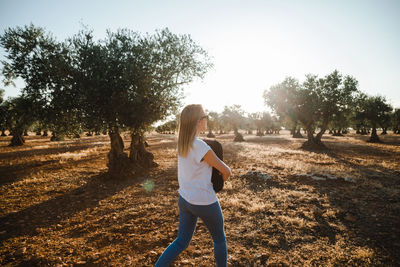 Full length of woman on field against sky