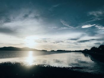 Scenic view of lake against sky during sunset