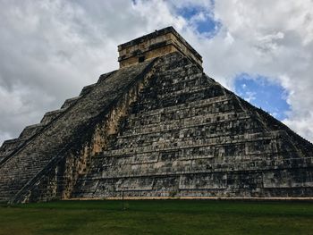 Low angle view of old temple against sky