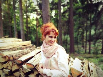 Portrait of smiling woman in forest