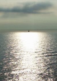 Scenic view of sea against sky at sunset