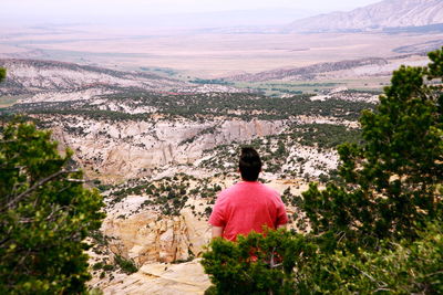 Rear view of woman against dinosaur national monument