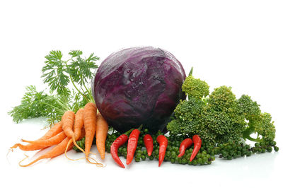 Close-up of fresh vegetables against white background