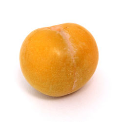 Close-up of orange apple against white background