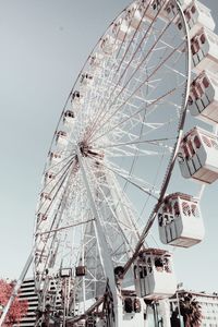 Low angle view of ferris wheel against sky