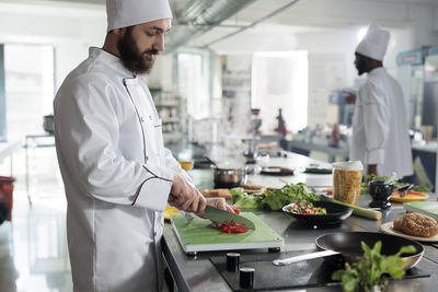 Midsection of doctor working at table