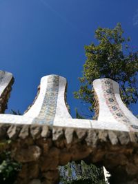 Low angle view of historical building against blue sky