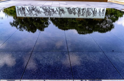 Reflection of building in puddle