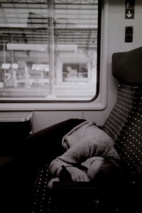 Man sleeping on train window