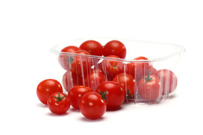 Close-up of tomatoes against white background