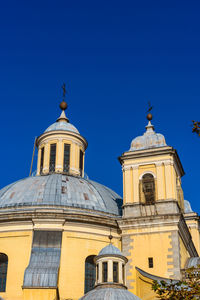 Low angle view of building against clear blue sky