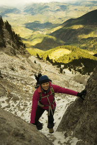 Woman standing on mountain road