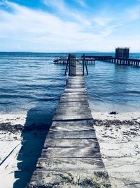 Pier over sea against sky