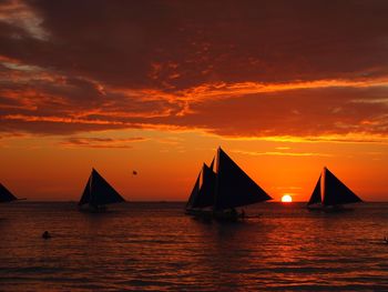 Scenic view of sea against orange sky