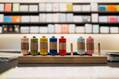 Close-up of multi colored spool on table