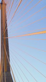 Low angle view of bridge against blue sky