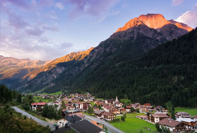 Houses on mountain against sky