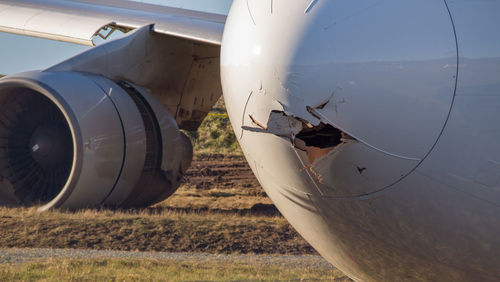 Close-up of crashed airplane on runway