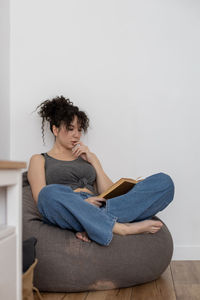 Man sitting on chair at home