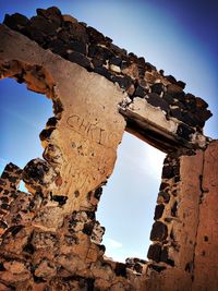 Low angle view of old ruins against sky