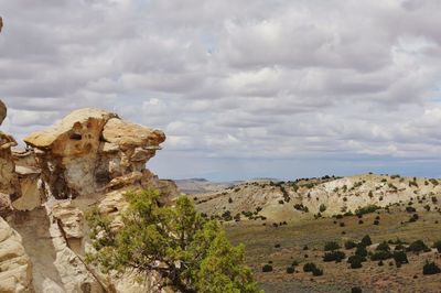 Rock formations on landscape against sky