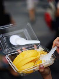 Close-up of hand holding ice cream