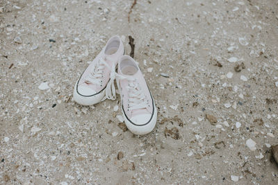 High angle view of shoes on sand