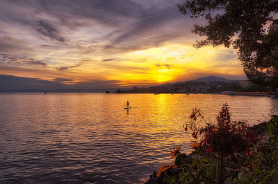 Scenic view of sea against orange sky