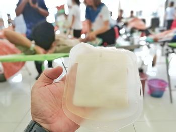 Close-up of hand holding ice cream