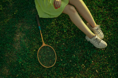 Low section of woman standing on grass