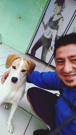 Portrait of smiling man with dog