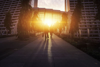 View of city street at sunset