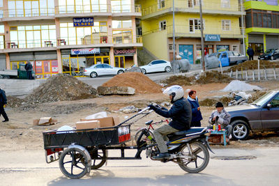 Man working on street in city