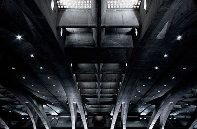 Low angle view of illuminated bridge in building