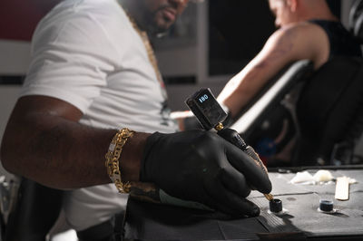 Midsection of man holding hands