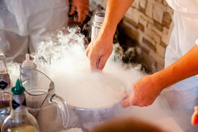 Midsection of person preparing food