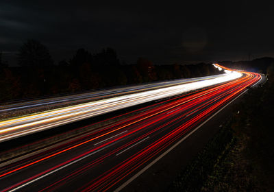 Light trails on road at night