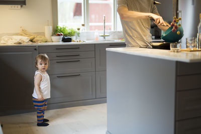 Father with daughter in kitchen