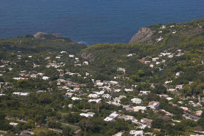 High angle view of buildings by sea