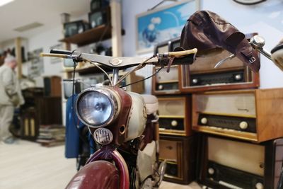 Close-up of vintage motorcycle with musical equipment in store