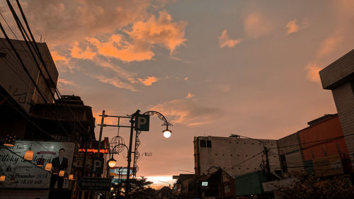 Low angle view of buildings against sky during sunset