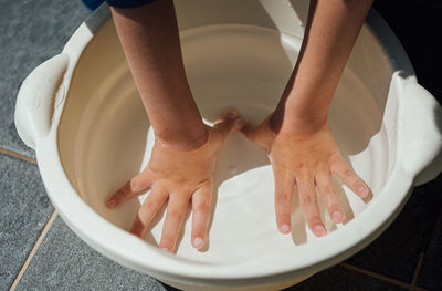 Low section of woman in bathtub