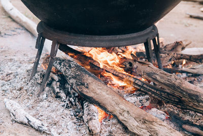 High angle view of firewood on barbecue grill