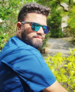 Portrait of young man wearing sunglasses
